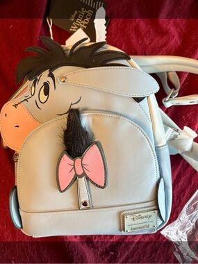 Loungefly Eeyore Mini Backpack in Light Gray with Pink Bow
